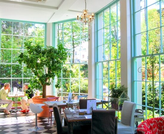 Photograph of the restaurant in Fern House Avoca Handweavers featuring beautiful bespoke panelled sash windows.