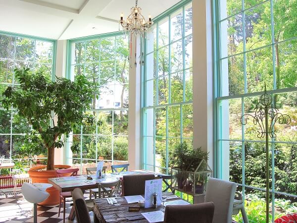 Photograph of the restaurant in Fern House Avoca Handweavers featuring beautiful bespoke timber panelled sash windows.